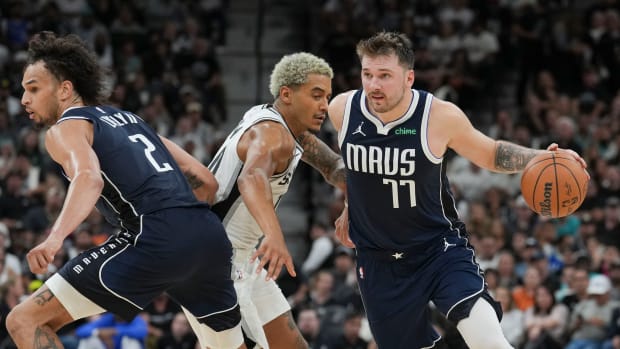 Luka Doncic and Dereck Lively II execute a pick-and-roll in the Dallas Mavericks' win over the San Antonio Spurs.